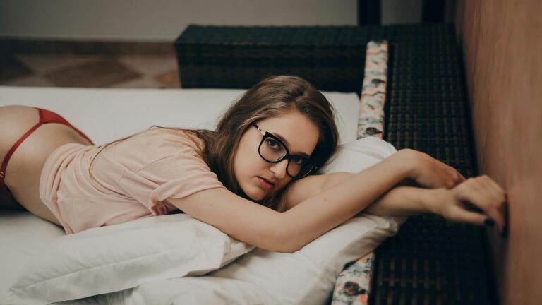 Woman Lying in Beige Crew-neck Shirt